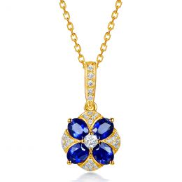 Pendentif solitaire fleur bleue. Or jaune, saphirs et diamants