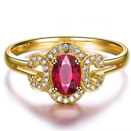 Bague de fiançailles en rubis diamants et or jaune. Motifs bouclés